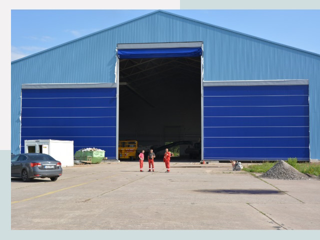 Ангарные ворота в Ханты-Мансийск от СтальСтрой-Хнт по цене 613 руб.